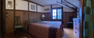 panoramic of room with bed and window